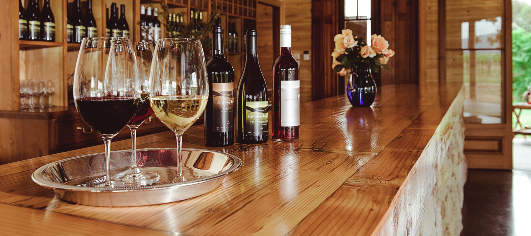 Whispering Brook wine glasses and bottles